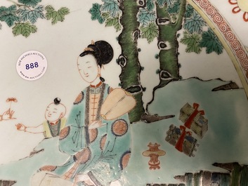 A large Chinese famille verte dish with ladies and boys in a garden, Kangxi